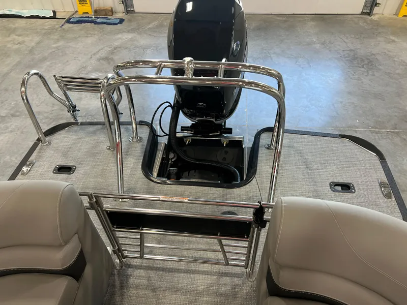 Slide: The Image of The image shows the rear of a 2024 Sylvan S-5 LZ DC boat with an outboard motor. - 9