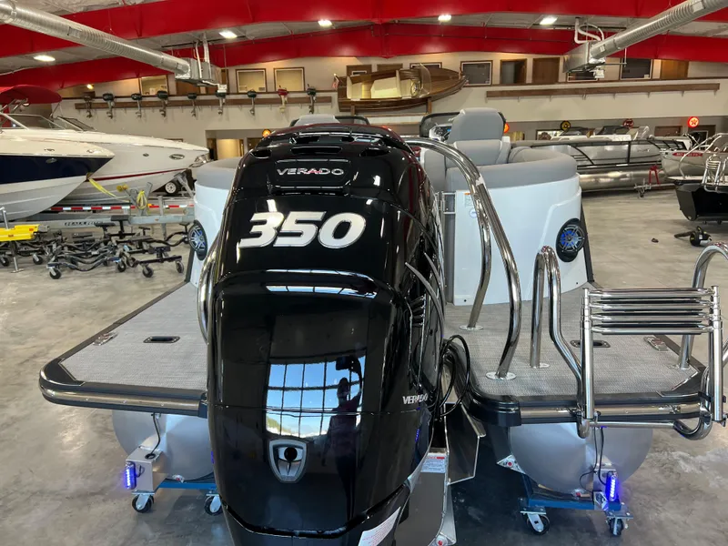 Slide: The Image of A 2024 Sylvan S-5 LZ DC with a 350 HP Verado engine in a showroom. - 6