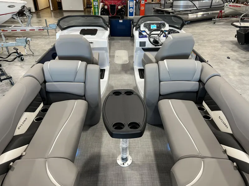 Slide: The Image of The image shows the interior of a 2024 Sylvan S-5 LZ DC boat with gray seating. - 8