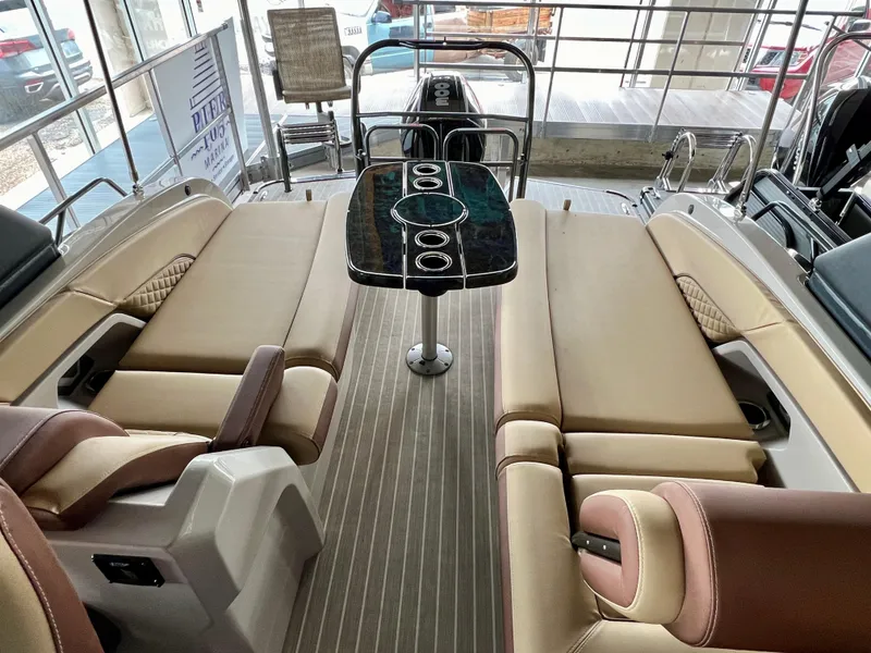 Slide: The Image of 2024 Princecraft Vogue 25 XT interior with luxurious seating and central table. - 8