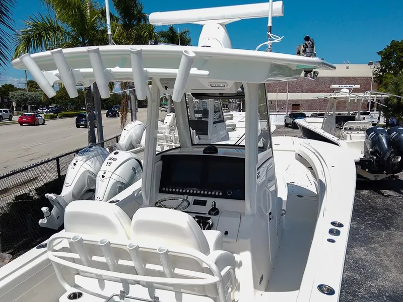 Slide: The Image of 2024 Regulator 28 boat with dual outboard engines and modern helm station. - 10