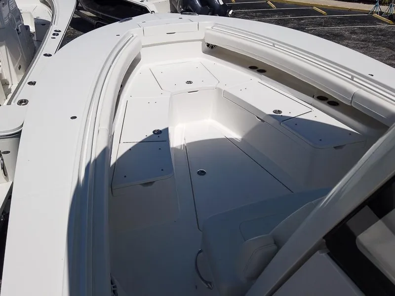 Slide: The Image of 2024 Regulator 28 boat interior, spacious seating and storage compartments. - 12