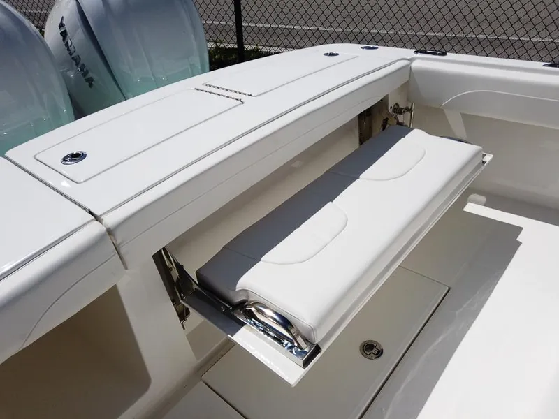 Slide: The Image of 2024 Regulator 28 boat with fold-down seating and Yamaha engines. - 18