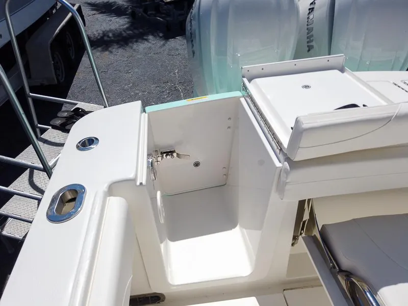 Slide: The Image of 2024 Regulator 28 boat interior, featuring a clean, white deck and seating area. - 19