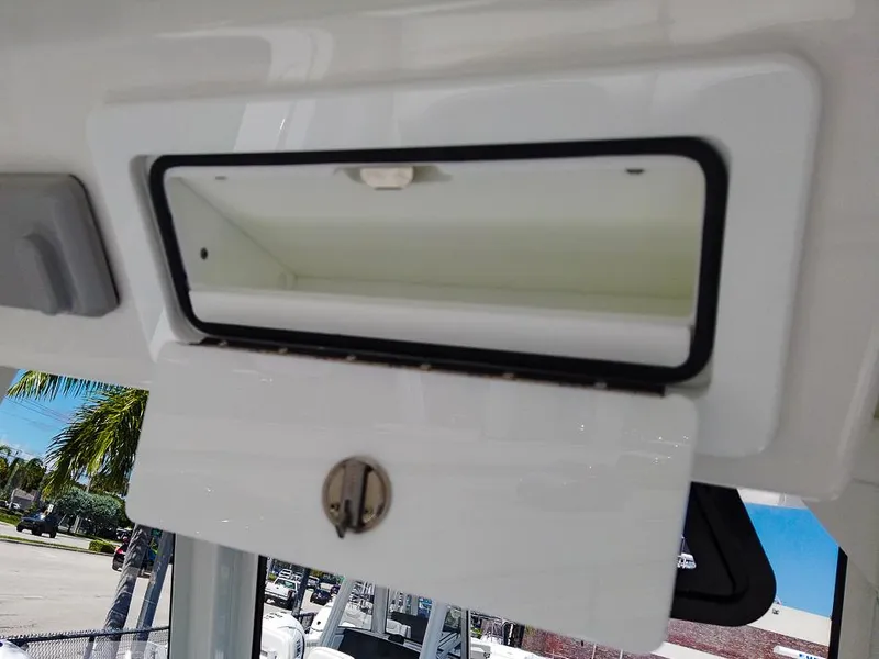 Slide: The Image of 2024 Regulator 28 boat storage compartment with open hatch. - 22