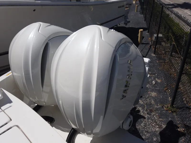Slide: The Image of Twin Yamaha outboard engines on a 2024 Regulator 28 boat. - 29