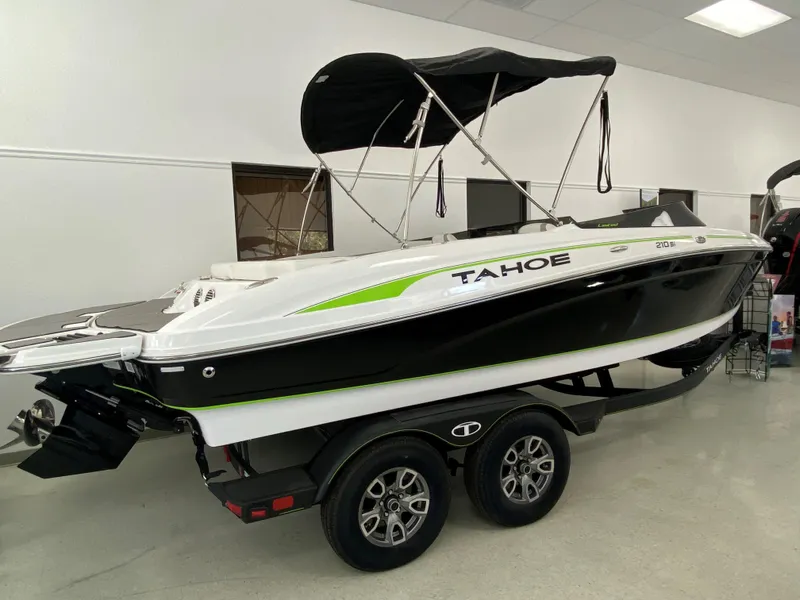 The Image of 2024 Tahoe 210 Si Limited boat with black and white design, displayed indoors. - 0