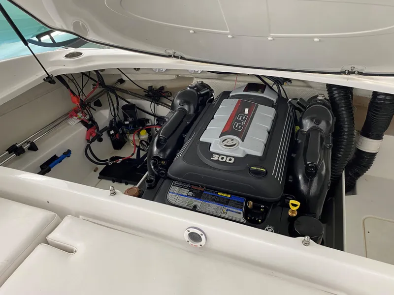 Slide: The Image of 2024 Tahoe 210 Si Limited boat engine compartment with 300 HP motor. - 6