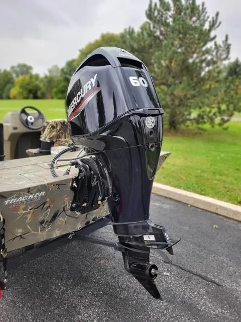 Slide: The Image of 2024 Tracker Grizzly 1754 SC with Mercury 60 outboard motor. - 2