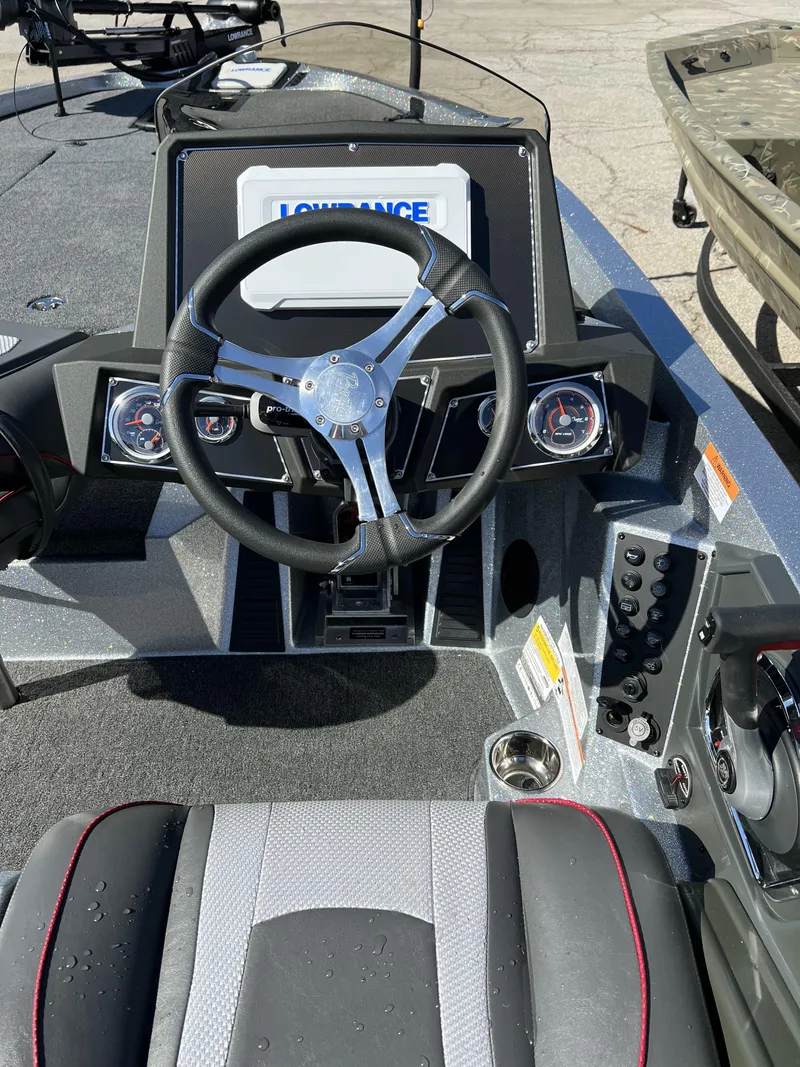 Slide: The Image of 2024 Ranger Z519 Ranger Cup Equipped boat dashboard with steering wheel and Lowrance display. - 5