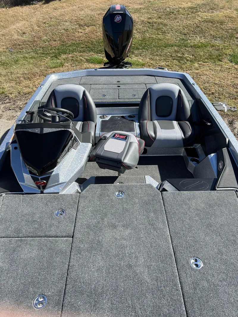 Slide: The Image of 2024 Ranger Z519 Ranger Cup Equipped fishing boat interior with seating and storage compartments. - 8