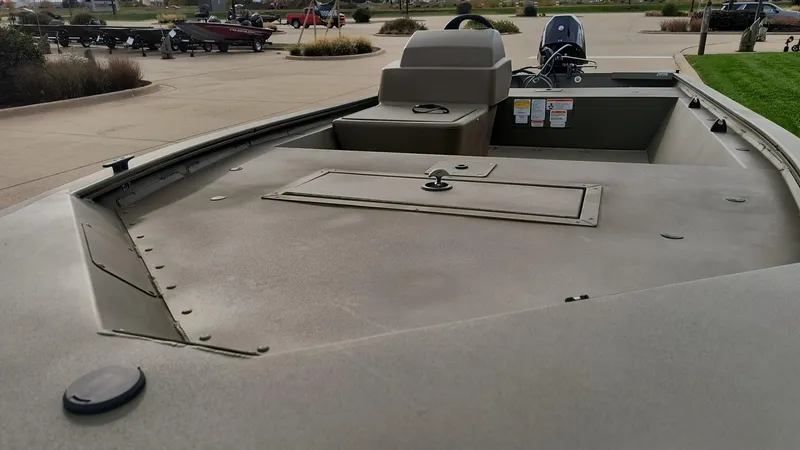 Slide: The Image of 2024 Tracker Grizzly 1648 SC fishing boat interior with storage compartments. - 2