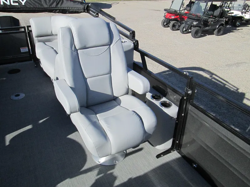 Slide: The Image of 2024 Regency 230 DL3 boat with luxurious gray seating and cup holders. - 10