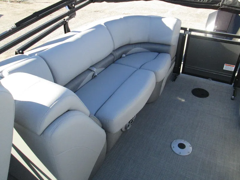 Slide: The Image of 2024 Regency 230 DL3 pontoon boat with spacious seating area. - 11