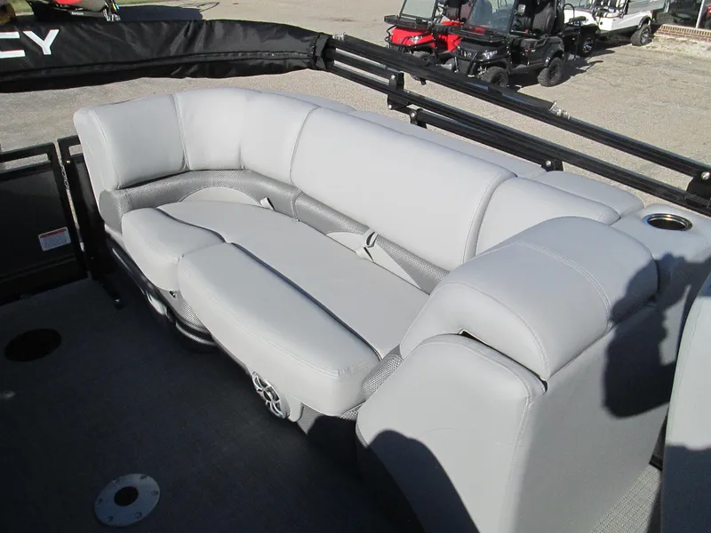 Slide: The Image of 2024 Regency 230 DL3 pontoon boat with luxurious gray seating. - 12