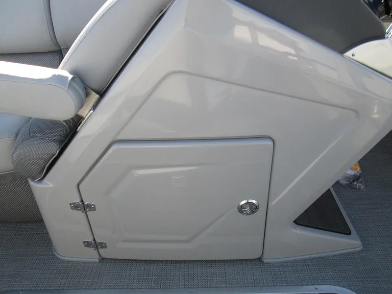 Slide: The Image of 2024 Regency 230 DL3 boat console storage compartment. - 19