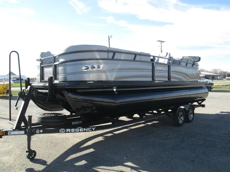 Slide: The Image of 2024 Regency 230 DL3 pontoon boat on a trailer. - 3