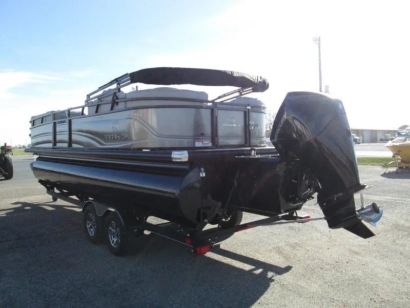 Slide: The Image of 2024 Regency 230 DL3 pontoon boat with outboard motor on trailer. - 5