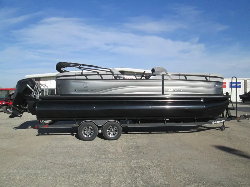 Slide: The Image of 2024 Regency 230 DL3 pontoon boat on a trailer. - 7