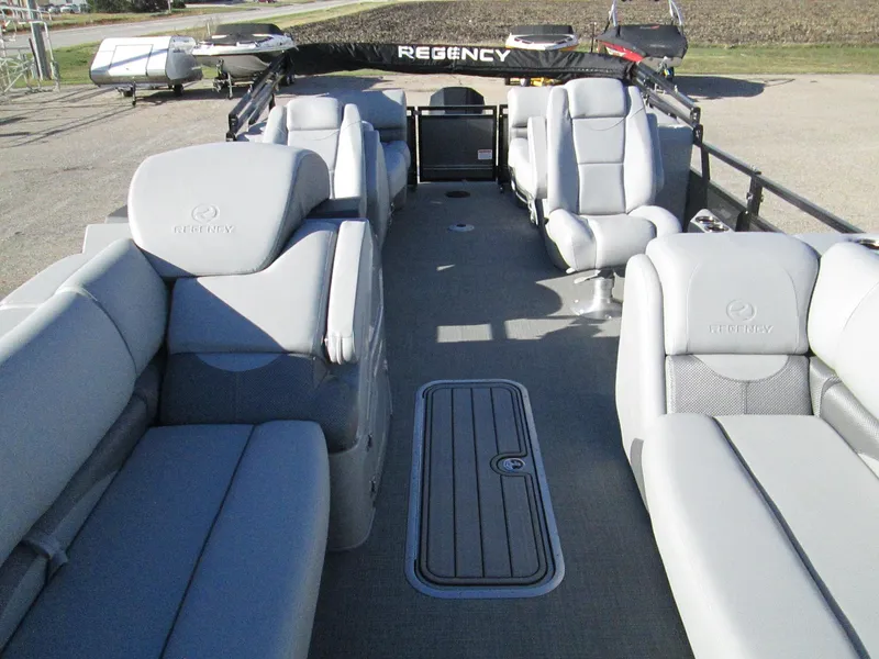 Slide: The Image of 2024 Regency 230 DL3 pontoon boat interior with luxurious seating and spacious layout. - 8