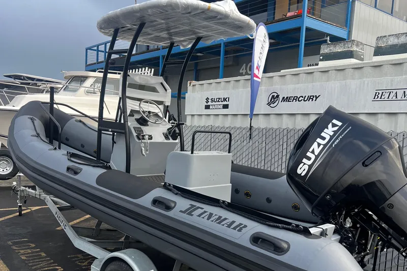 The Image of 2024 Inmar 670 Demo Boat with Suzuki outboard motor on display. - 0
