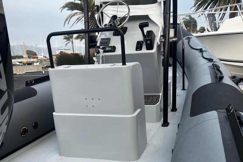 Slide: The Image of 2024 Inmar 670 Demo Boat interior with steering console and seating. - 11