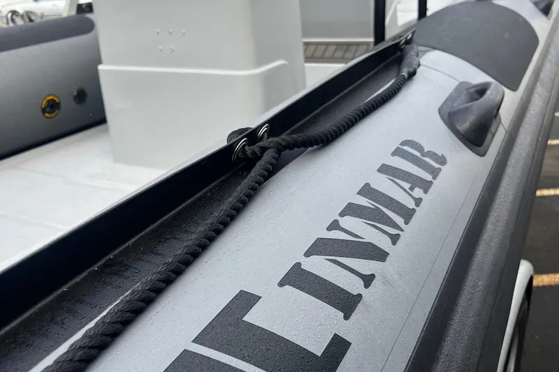 Slide: The Image of Close-up of 2024 Inmar 670 Demo Boat showing branding and rope detail. - 12