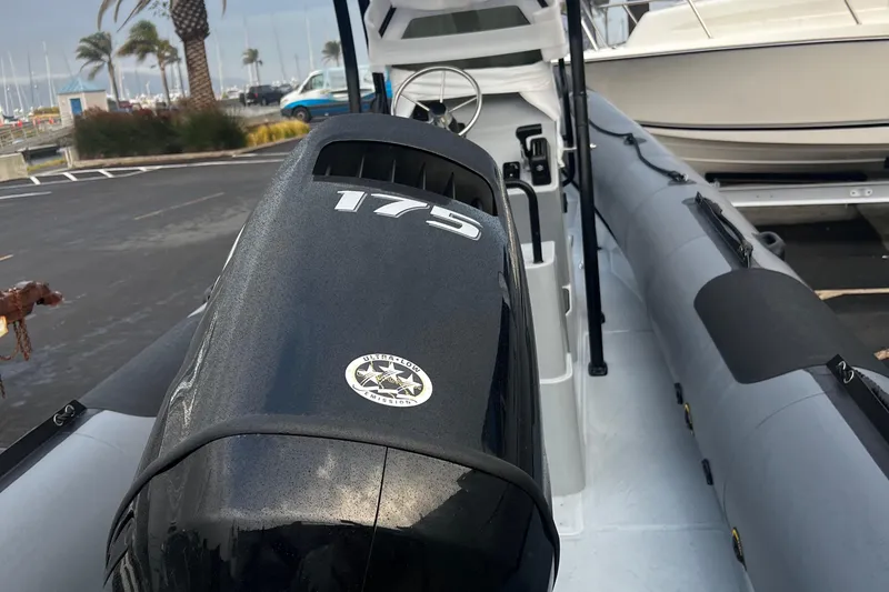 Slide: The Image of 2024 Inmar 670 Demo Boat with 175 HP engine at marina. - 3