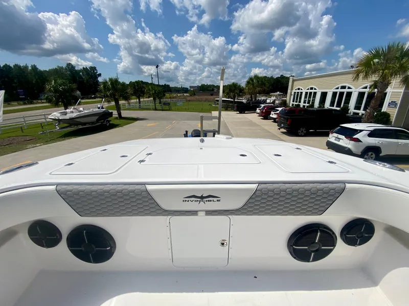 Slide: The Image of 2022 Invincible 35 Catamaran boat deck with storage compartments and speakers. - 37