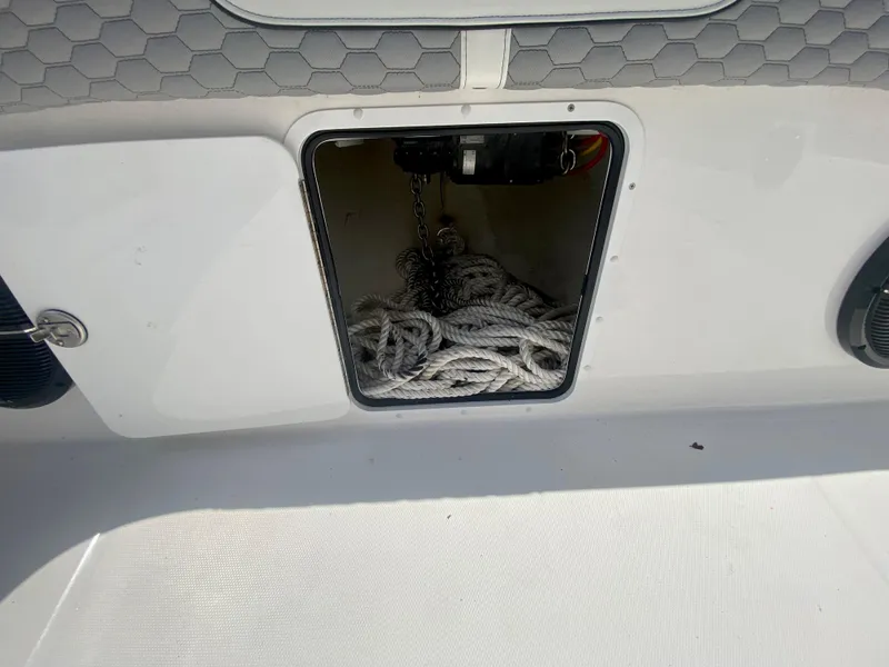 Slide: The Image of Open storage compartment with ropes on a 2022 Invincible 35 Catamaran. - 41