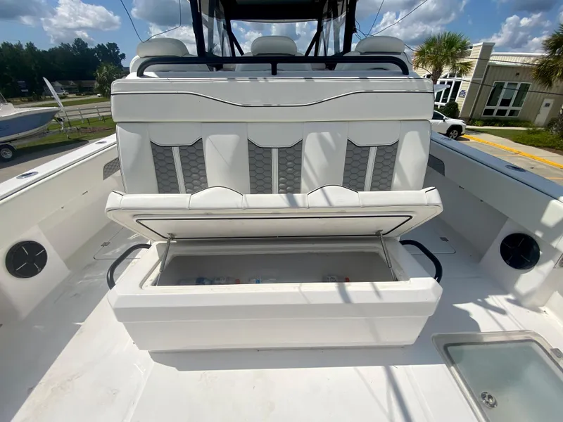 Slide: The Image of 2022 Invincible 35 Catamaran with open storage compartment and cushioned seating. - 11