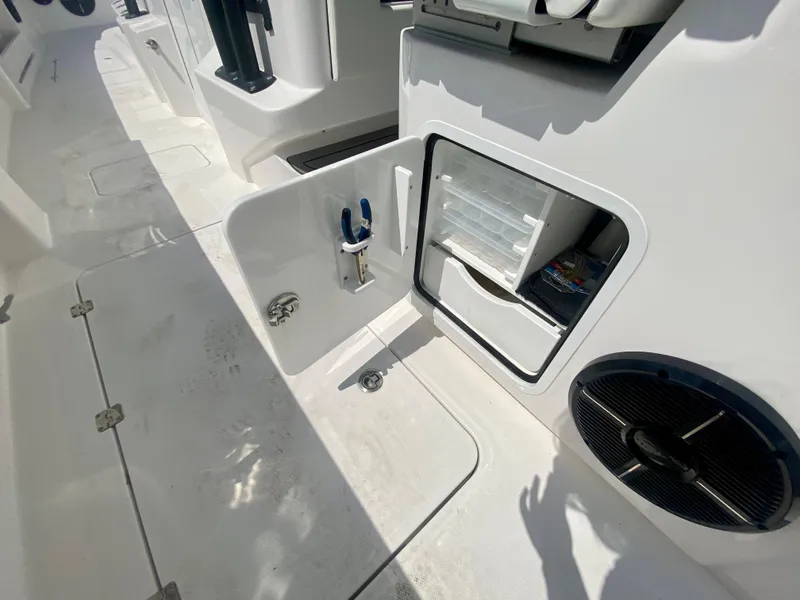 Slide: The Image of 2022 Invincible 35 Catamaran storage compartment and deck view. - 13