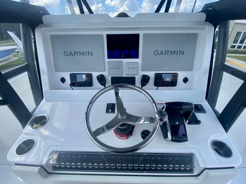 Slide: The Image of Control console of a 2022 Invincible 35 Catamaran with Garmin navigation systems. - 18