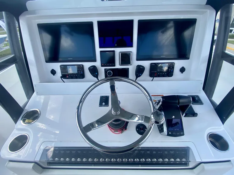 Slide: The Image of 2022 Invincible 35 Catamaran helm with advanced navigation and control systems. - 19