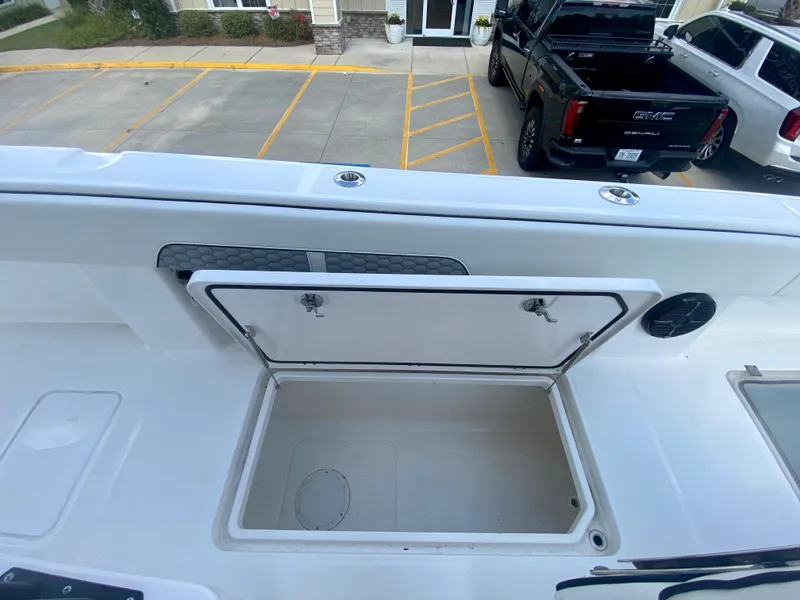 Slide: The Image of 2022 Invincible 35 Catamaran open storage compartment on deck. - 23