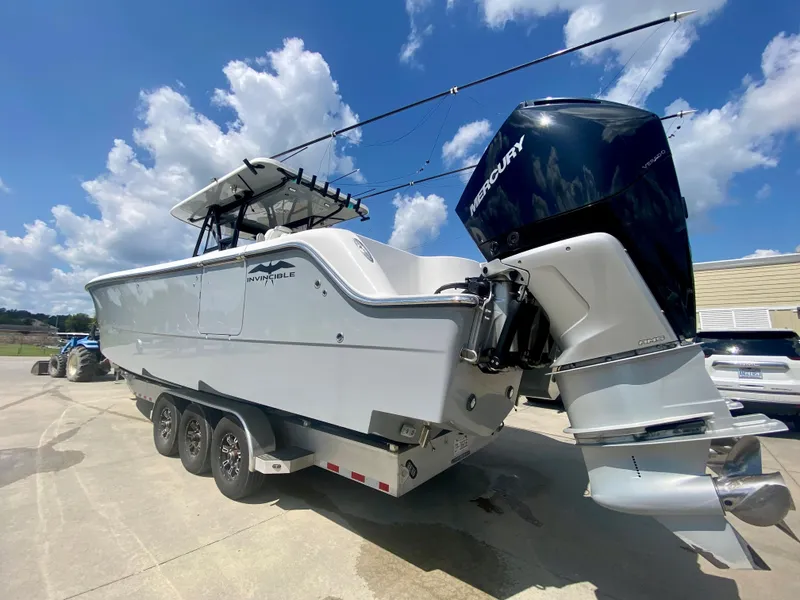 Slide: The Image of 2022 Invincible 35 Catamaran with Mercury outboard engines on a trailer. - 4