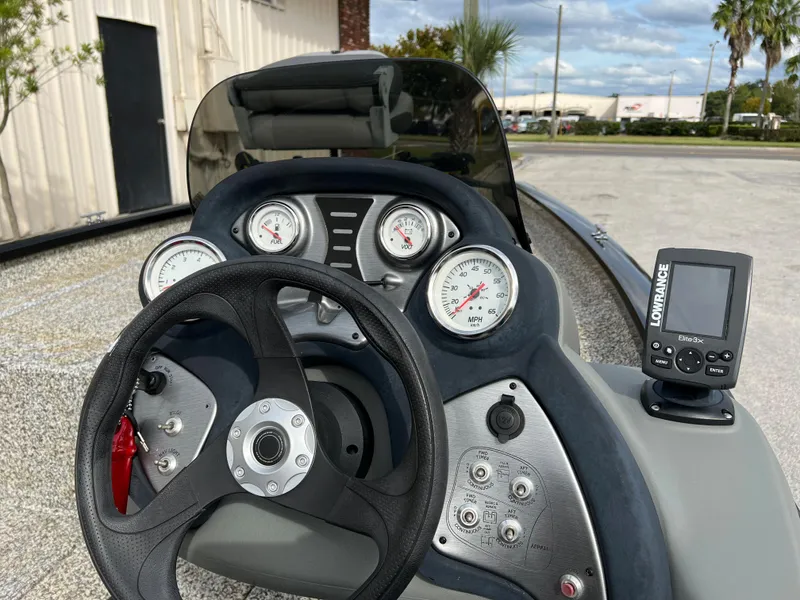 Slide: The Image of 2015 Tracker Pro Team 175 TXW boat dashboard with steering wheel and Lowrance fishfinder. - 10