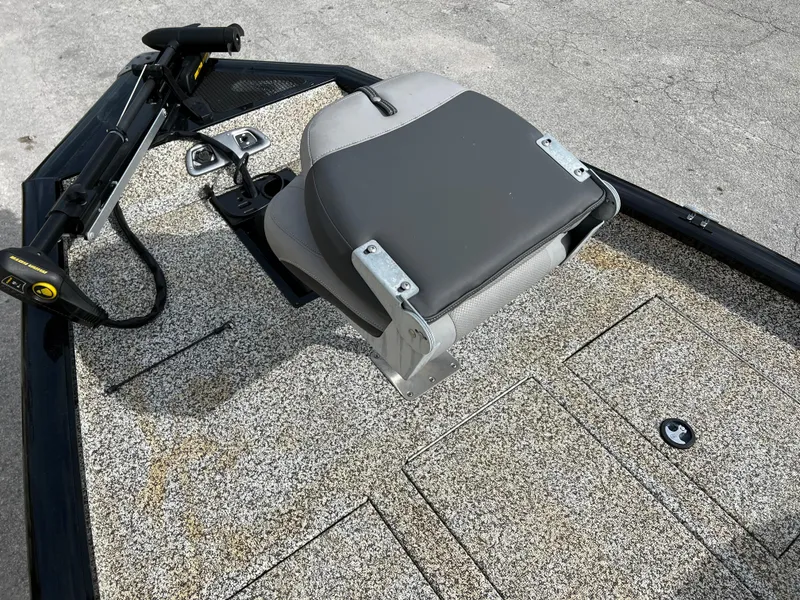 Slide: The Image of 2015 Tracker Pro Team 175 TXW fishing boat with a gray seat and trolling motor. - 11