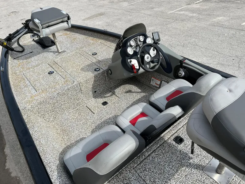 Slide: The Image of 2015 Tracker Pro Team 175 TXW fishing boat interior with seating and control console. - 19