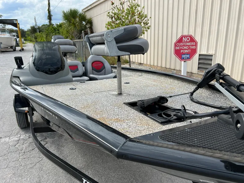 Slide: The Image of 2015 Tracker Pro Team 175 TXW fishing boat with seating and storage compartments. - 3