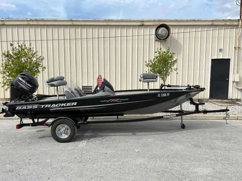 Slide: The Image of 2015 Tracker Pro Team 175 TXW bass boat on trailer. - 6