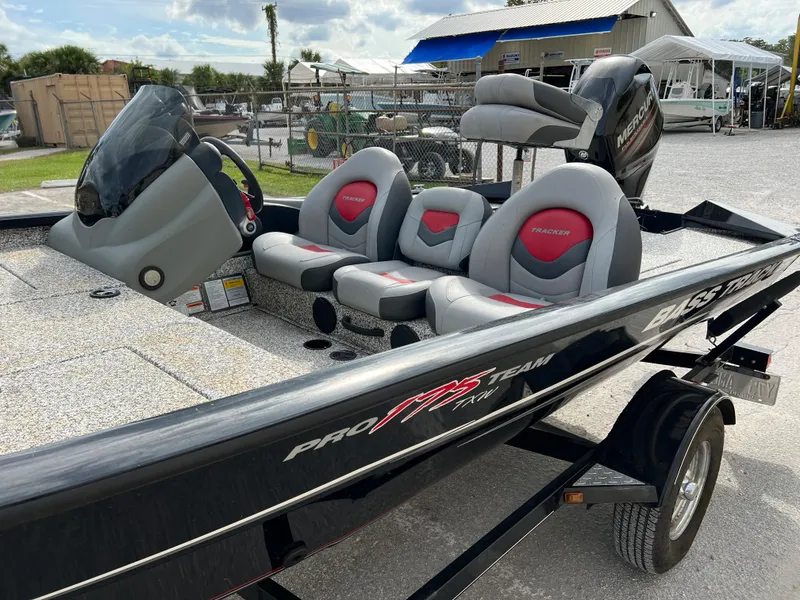 Slide: The Image of 2015 Tracker Pro Team 175 TXW bass boat with seating and console. - 8