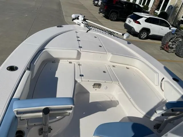 Slide: The Image of 2022 Robalo 246 Cayman boat interior with storage compartments and seating. - 10