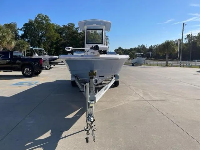 Slide: The Image of 2022 Robalo 246 Cayman boat on trailer in parking lot. - 3