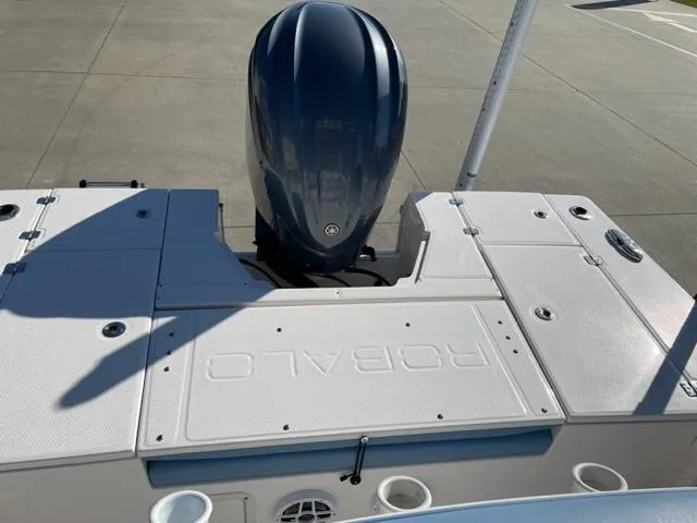 Slide: The Image of 2022 Robalo 246 Cayman boat with outboard motor, rear deck view. - 4