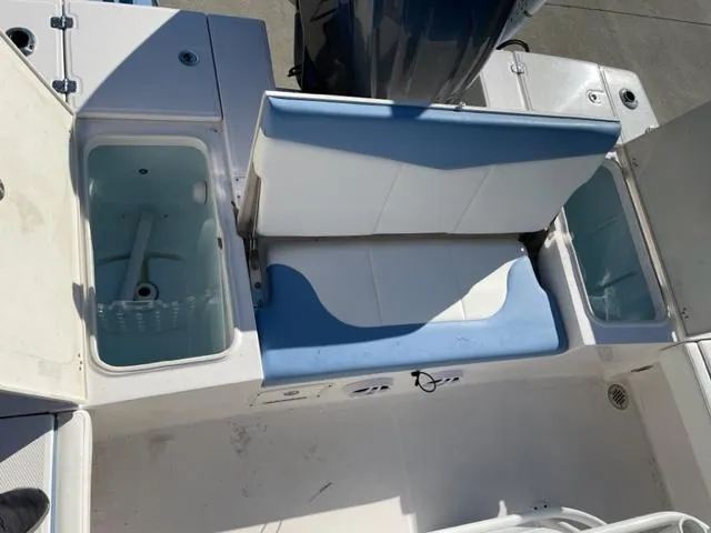 Slide: The Image of 2022 Robalo 246 Cayman boat seating and storage compartments. - 5