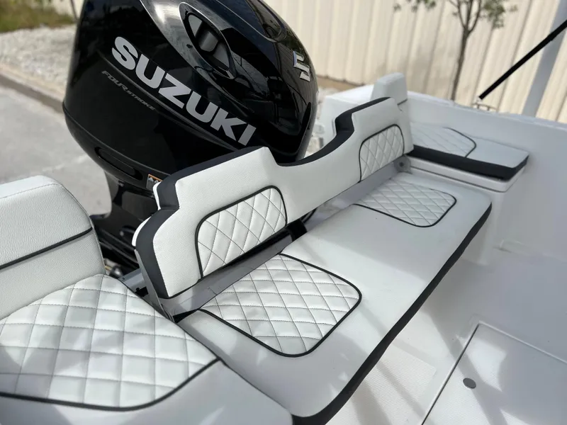 Slide: The Image of Clearwater 1900 2024 boat with Suzuki engine and white quilted seating. - 12