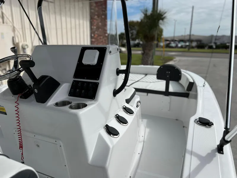 Slide: The Image of Clearwater 1900 boat console, 2024 model, featuring modern controls and cup holders. - 14