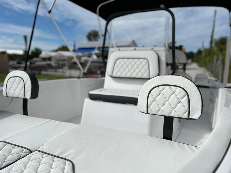 Slide: The Image of Clearwater 1900 boat 2024 model with white quilted seats and black trim. - 17