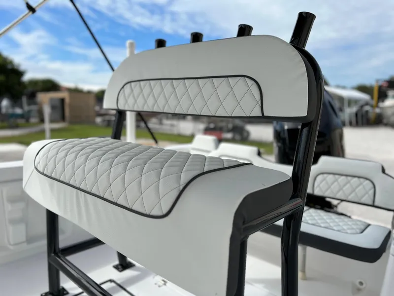 Slide: The Image of Clearwater 1900 2024 boat with diamond-stitched seating, outdoor setting, and blue sky background. - 18